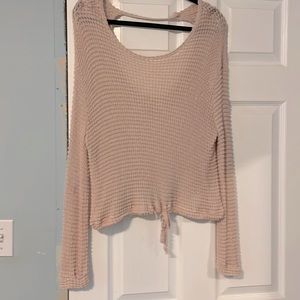 Light pink sweater.